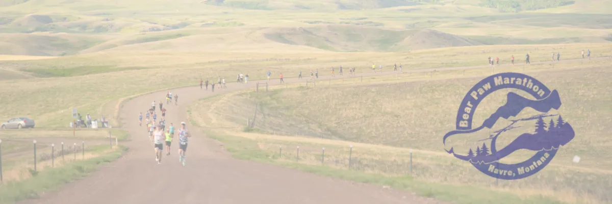 Runners on a winding road through rolling hills with the Bear Paw Marathon logo overlaid.