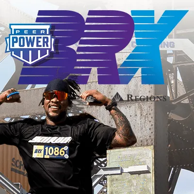 A runner with sunglasses and dreadlocks poses confidently in front of a bridge structure, with large race branding overlaid.