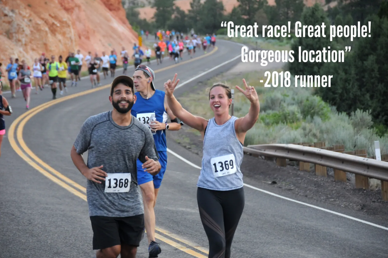 Two runners smiling and giving peace signs while running a race with a scenic canyon background and a quote overlay.