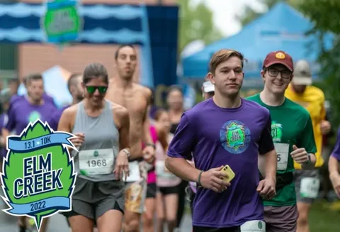 Runners participating in the Elm Creek race, with the race logo visible on the left.