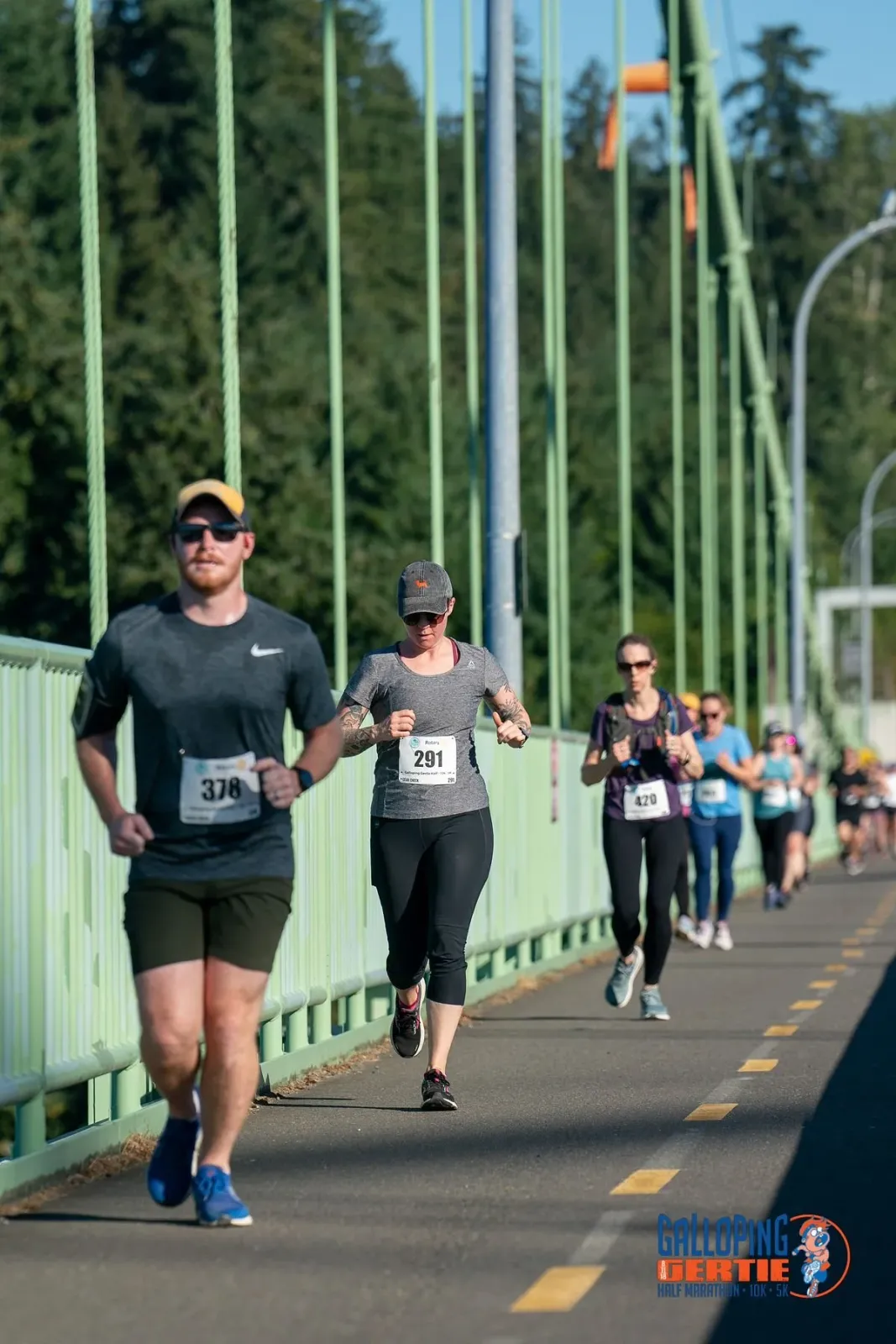 Runners on a bridge during the Galloping Gertie Half Marathon.