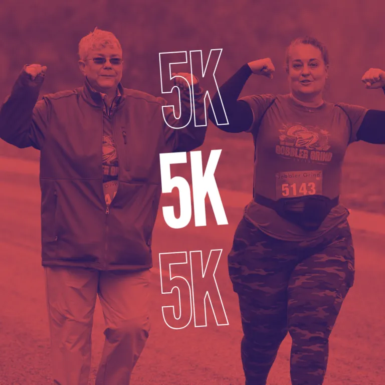 Two runners, one man and one woman, flexing their biceps and smiling. The word '5K' is repeated three times in large white font over the image.