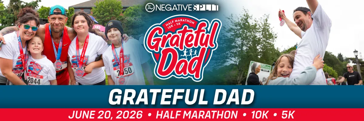 A family smiles and hugs, wearing medals and race t-shirts, with the Grateful Dad Half Marathon logo visible.
