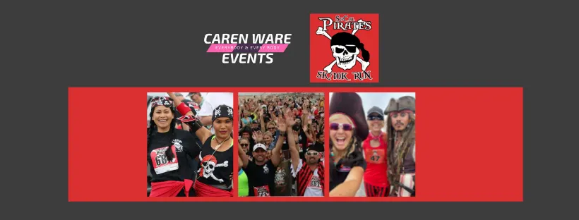 Runners in pirate-themed costumes and race bibs smiling and waving at the camera, with a large crowd in the background.