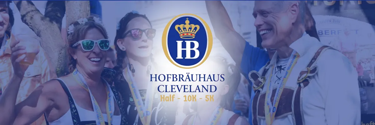 A group of smiling people wearing race medals and festive attire, with the Hofbräuhaus Cleveland logo and race distances overlaid.