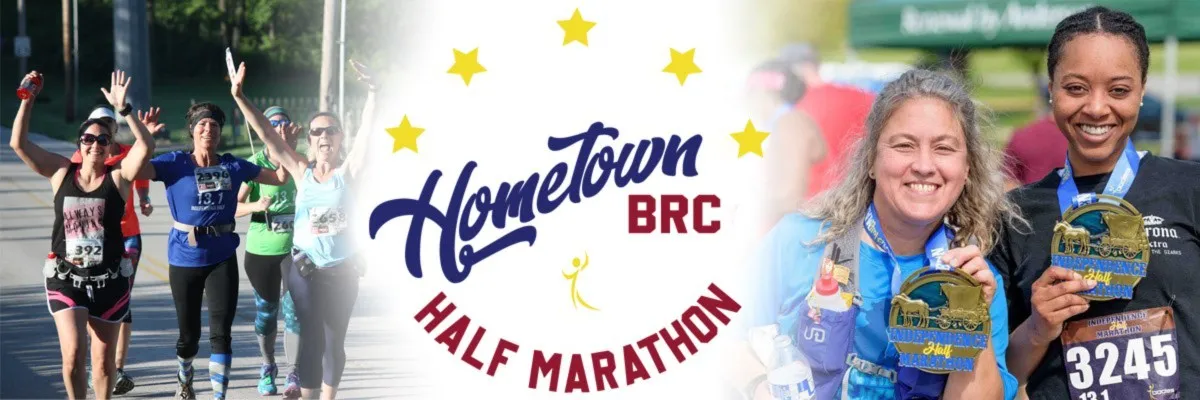 Runners celebrating at the finish line of the Hometown Half Marathon, holding medals.