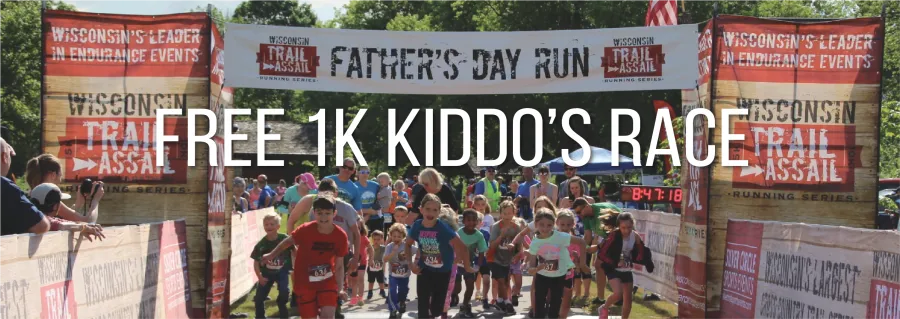 A group of children running towards the camera, with a banner overhead that reads 'FATHER'S DAY RUN' and large white text overlaying the image that says 'FREE 1K KIDDO'S RACE'.