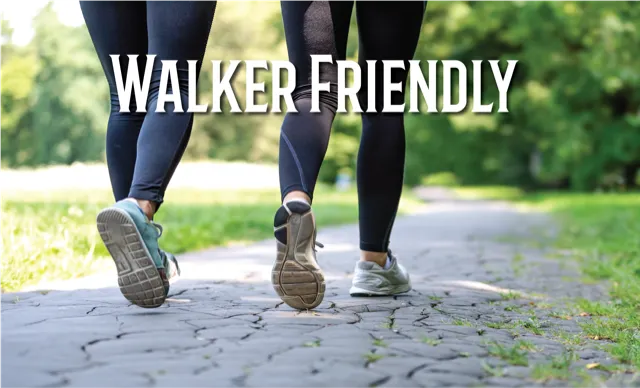 Two people walking on a paved path with the text 'WALKER FRIENDLY' overlaid.