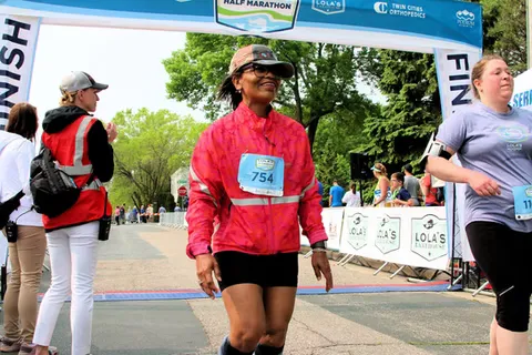 Runners crossing the finish line at Lola's Lake Half Marathon.