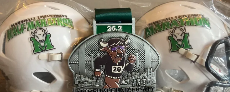 Marshall University Half Marathon medal and helmets