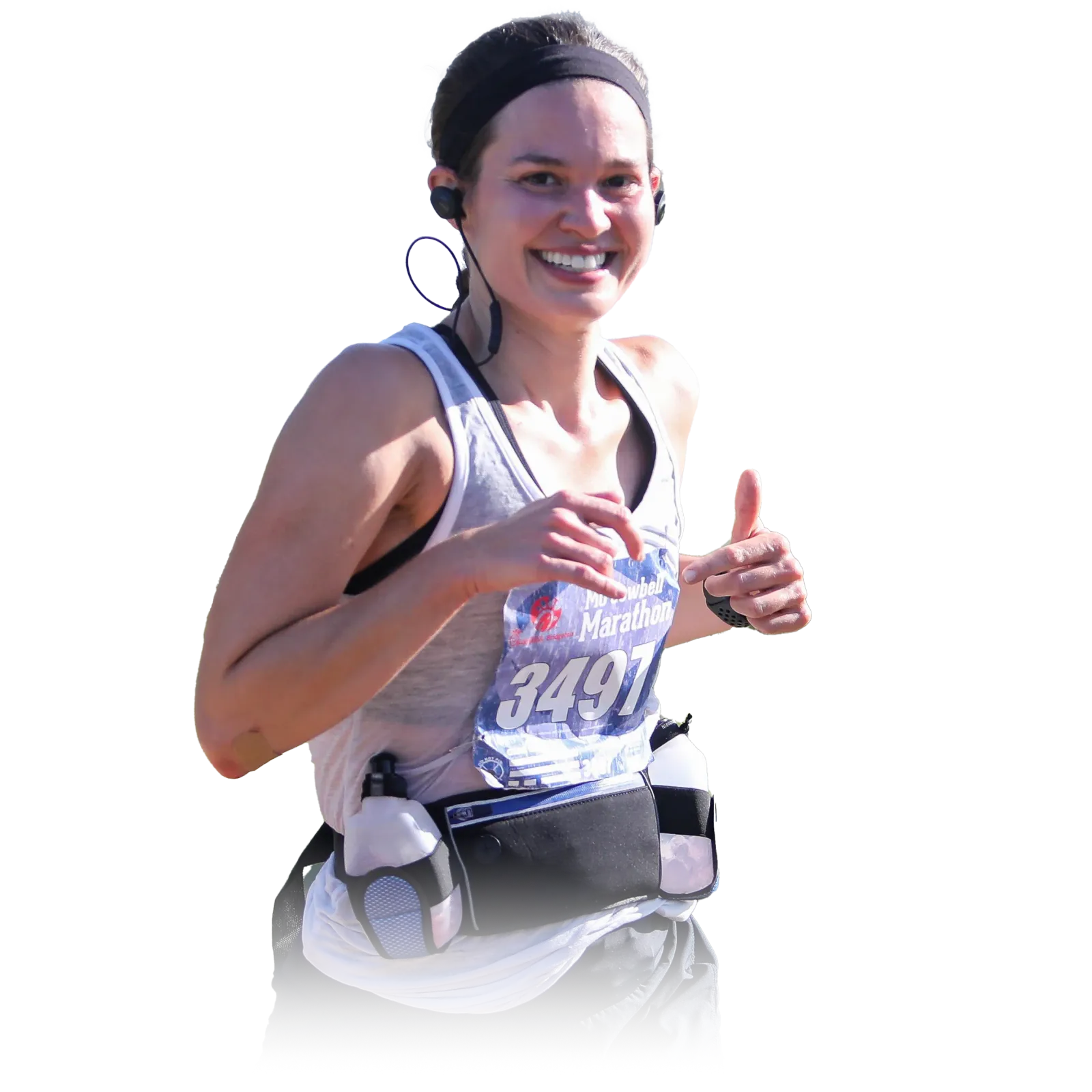 A female runner smiles and gives a thumbs up while running, wearing a bib with the number 3497 and the Mo' Cowbell Marathon logo.