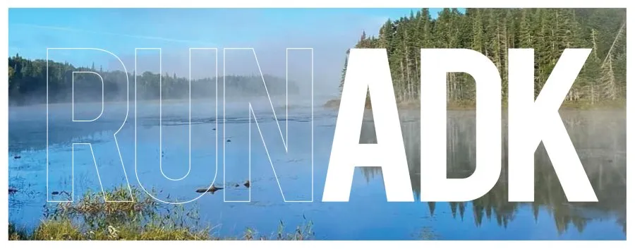 Scenic view of a misty lake and forest with the text 'RUN ADK' overlaid.