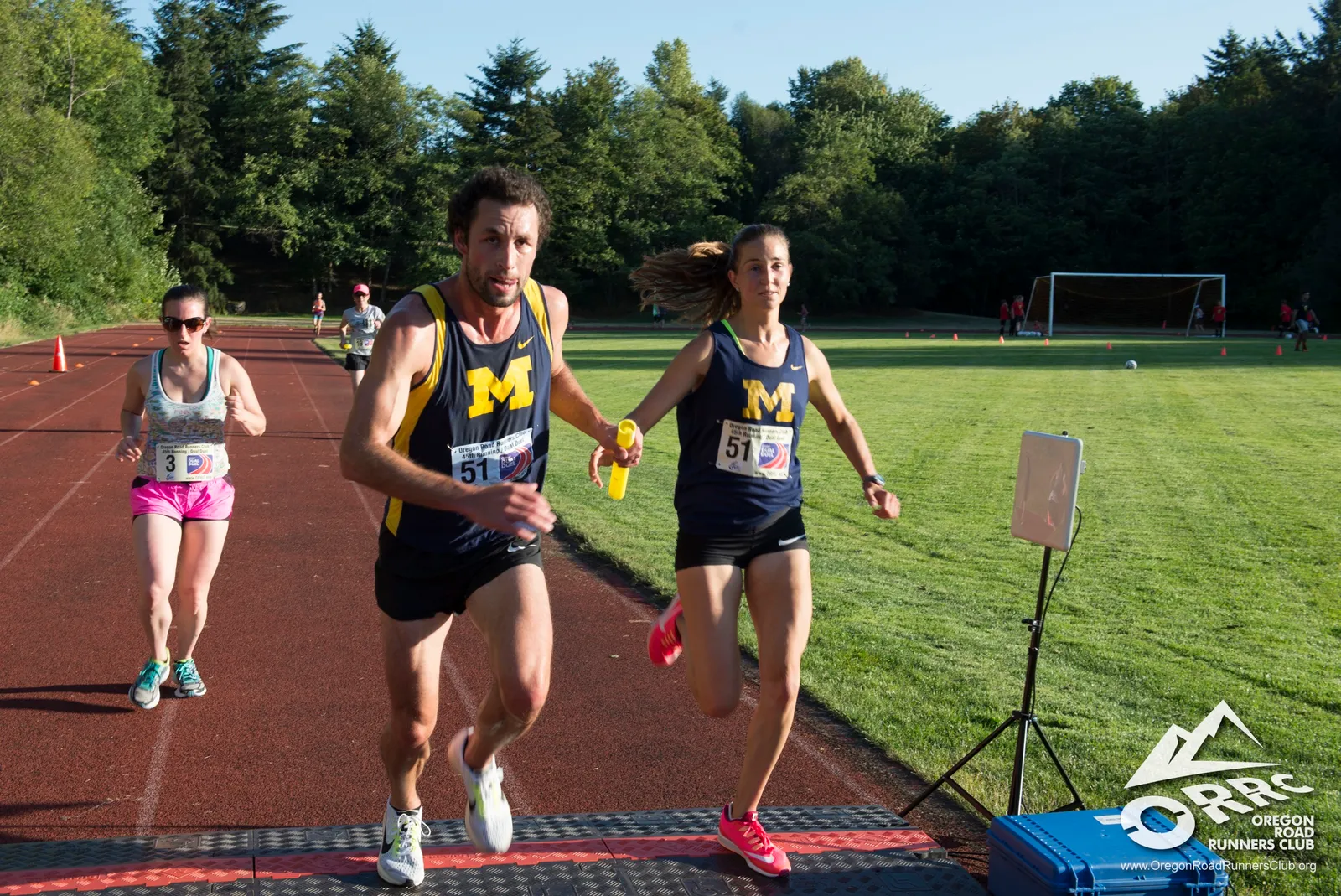 Runners crossing the finish line at the ORRC Pumpkin Ridge Run.