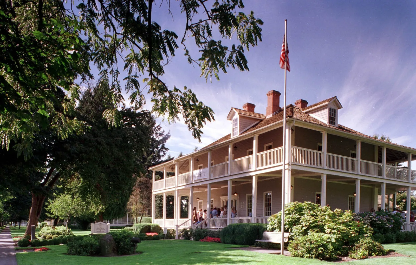 Grant House Restaurant on Officers Row with people gathered on the porch.