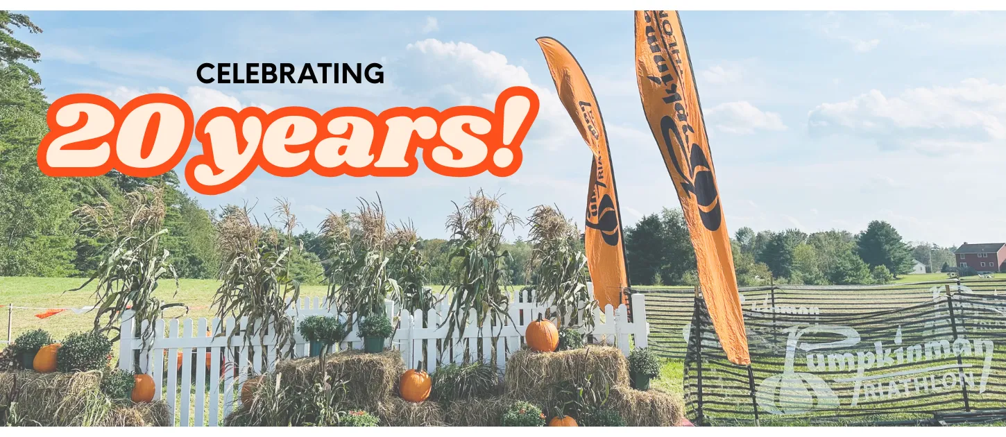 Celebrating 20 years of the Pumpkinman Triathlon with festive fall decorations and race flags.