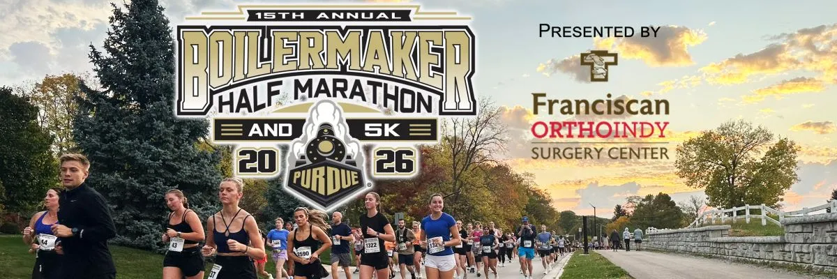 Runners participating in the Purdue Boilermaker Half Marathon and 5K, with the race logo and sponsor information visible.