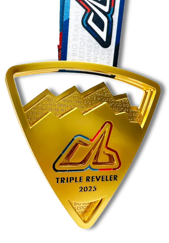 A gold medal for the Triple Reveler 2025 race, featuring mountain imagery and the race logo.