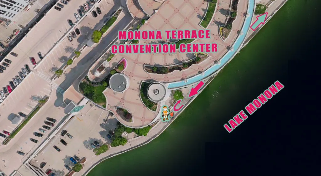 Aerial view of the Monona Terrace Convention Center and Lake Monona, with directional arrows indicating the race course.