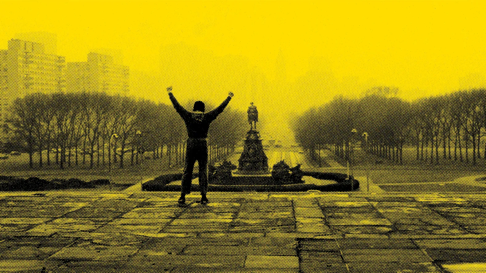 Silhouette of a runner with arms raised in triumph at the top of a wide stone staircase, with a statue in the background.
