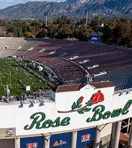 Aerial view of the Rose Bowl stadium with the iconic 'Rose Bowl' lettering visible.