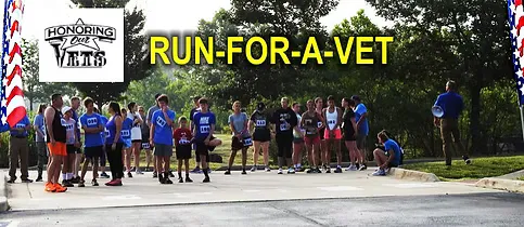 Runners gather at the start line for the Run For A Vet race, with American flags and race branding visible.
