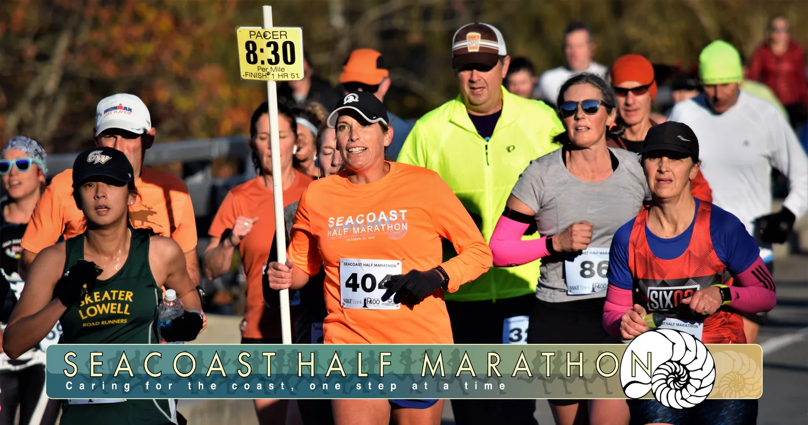 Runners participating in the Seacoast Half Marathon, with a prominent 'PACER 8:30' sign and the race logo visible on participant shirts.