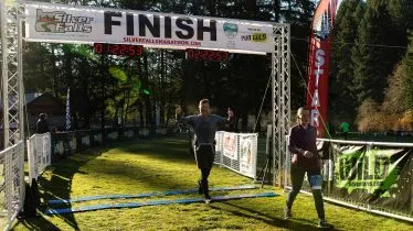 Runners crossing the finish line at the Silver Falls Trail Marathon.