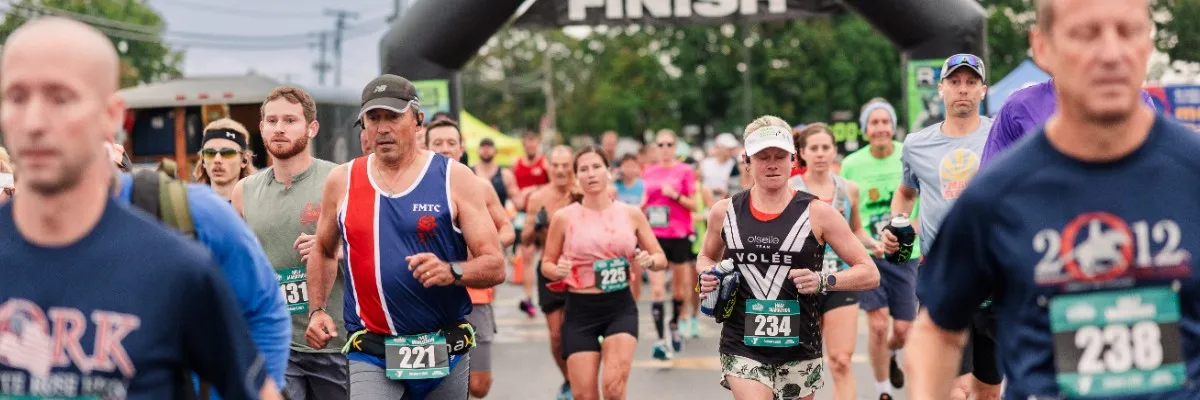 Runners approaching the finish line at the Snack Town RunFest.