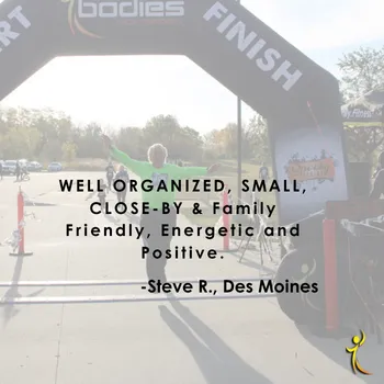 A runner celebrates at the finish line with arms outstretched, under an archway. Text overlay reads: WELL ORGANIZED, SMALL, CLOSE-BY & Family Friendly, Energetic and Positive. -Steve R., Des Moines