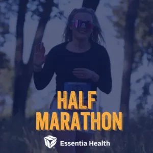 A female runner smiles and waves while running on a road, with 'HALF MARATHON' text overlay.