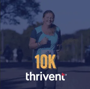 A smiling woman runs a 10K race, wearing a bib number and athletic clothing. The Thrivent logo is visible.