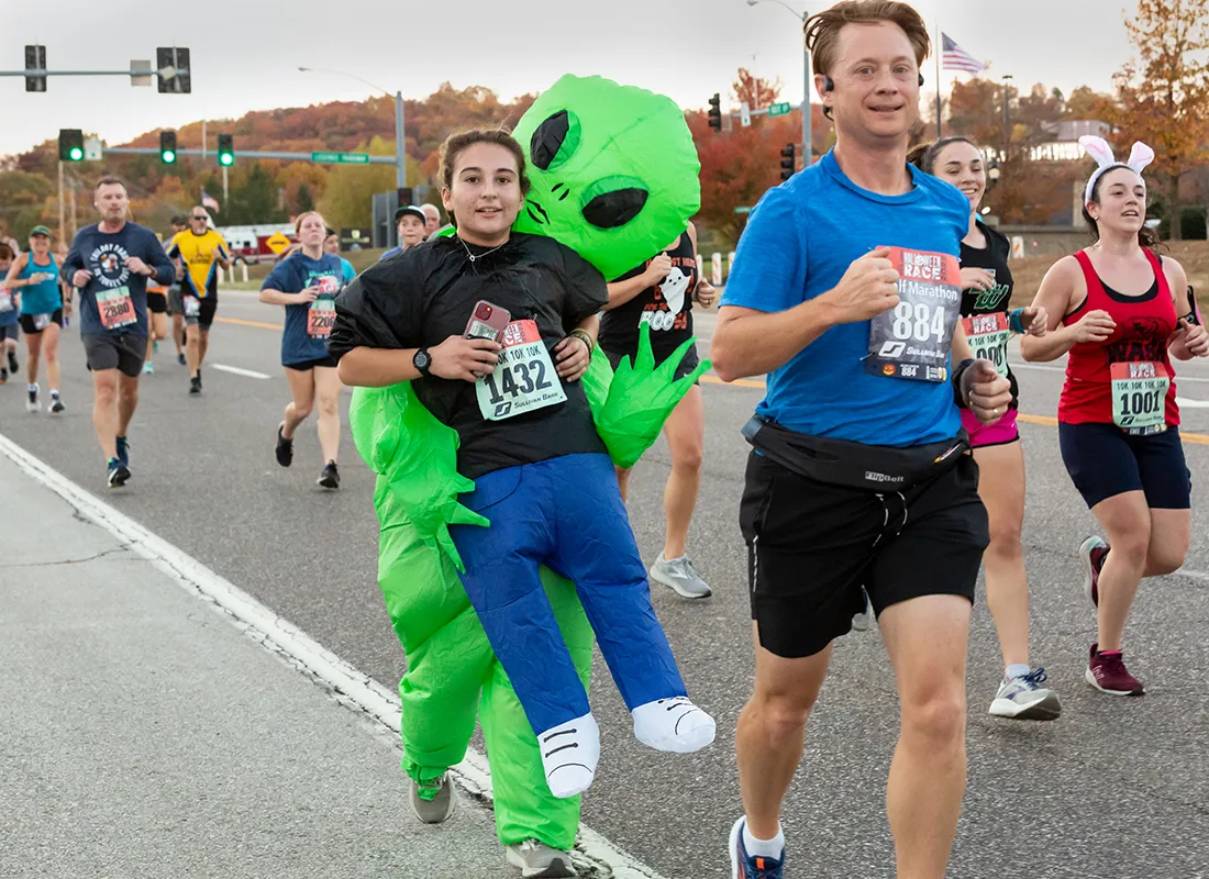 Runners in costumes and racing gear participate in the Great Go St. Louis Halloween Race.