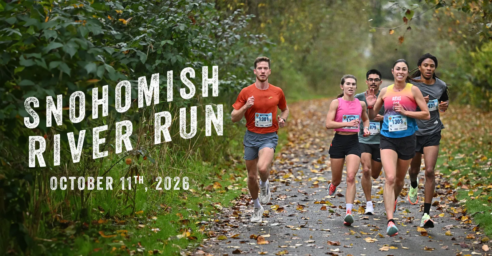 Runners on a tree-lined road during the Snohomish River Run.